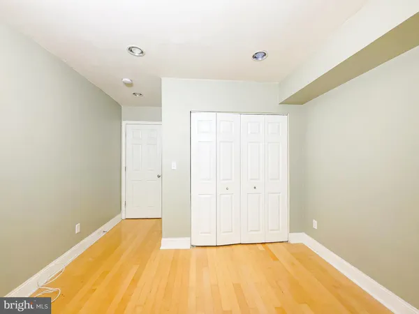 a view of a room with a wooden floor