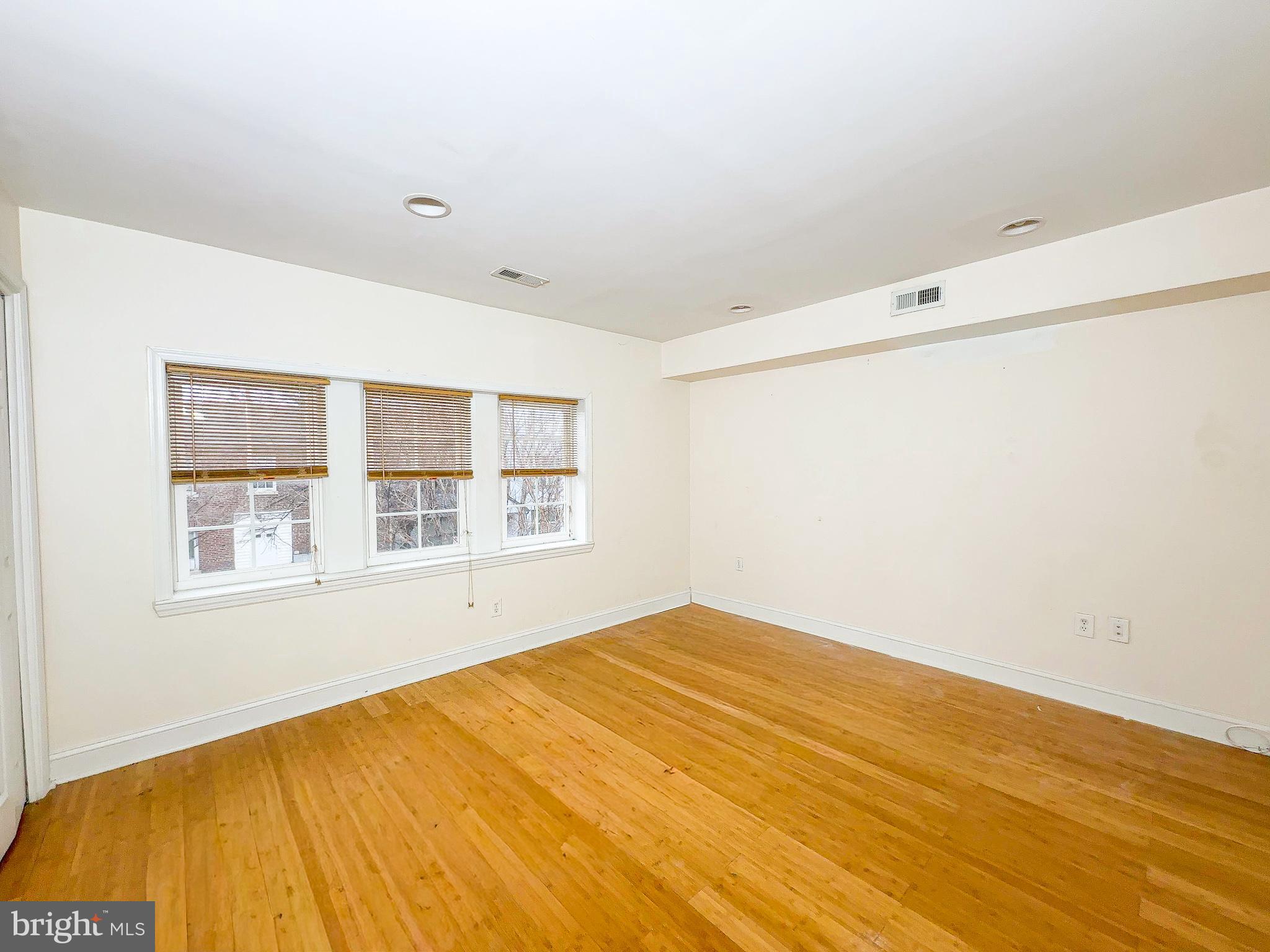 1835 D Street Northeast Washington, DC 20002 - Photo 27 of 42 a view of empty room with wooden floor