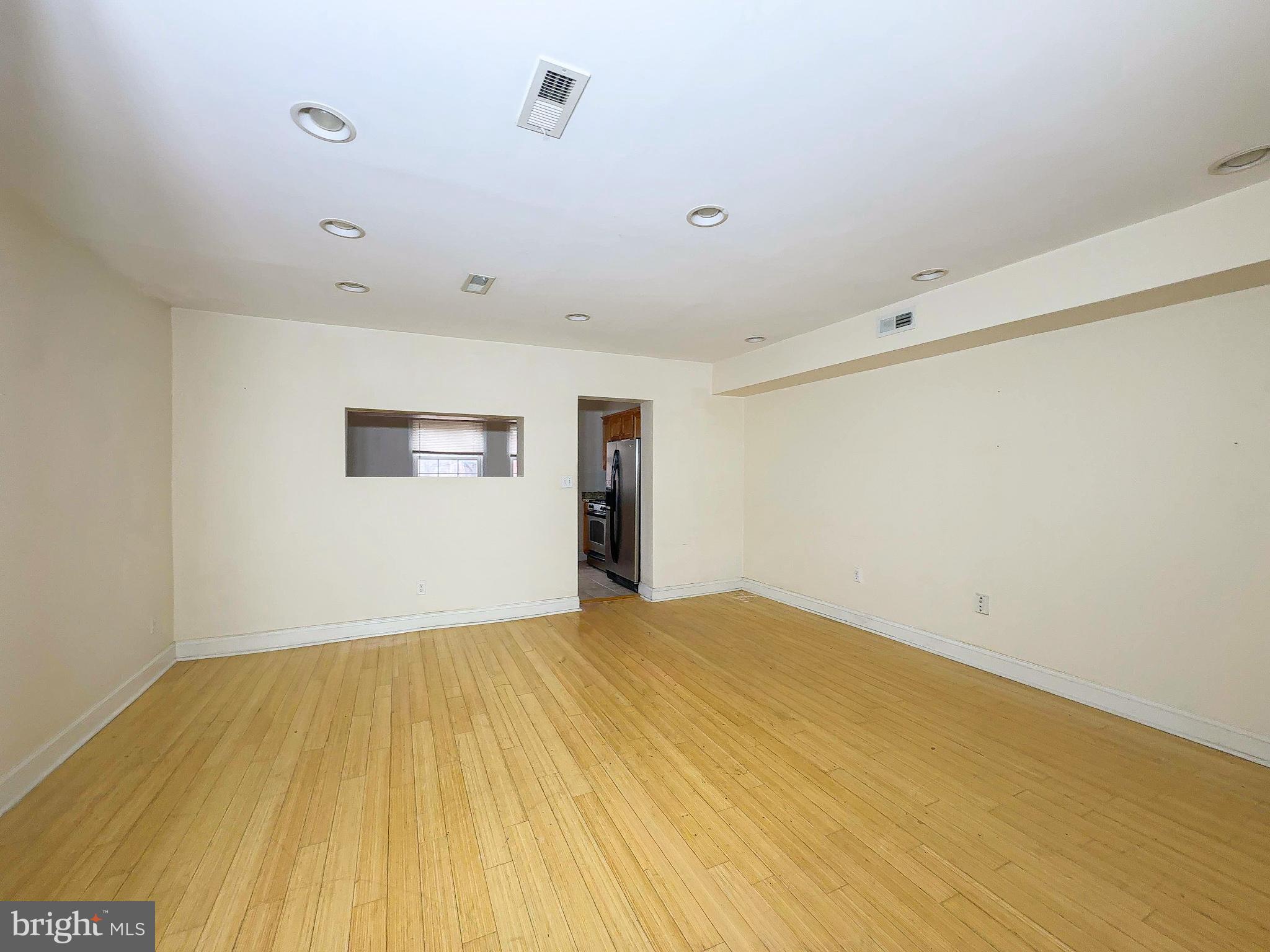 1835 D Street Northeast Washington, DC 20002 - Photo 35 of 42 a view of empty room with wooden floor