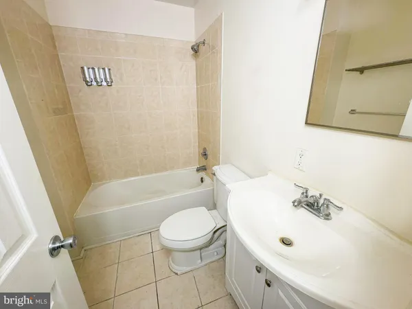 a bathroom with a sink a toilet and a bathtub