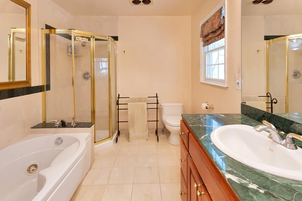 5 Country Club Road Darien, CT 06820 - Photo 14 of 20 a bathroom with a tub sink and mirror