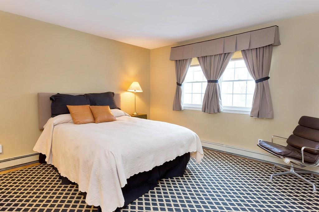 5 Country Club Road Darien, CT 06820 - Photo 15 of 20 a bedroom with a bed and a window