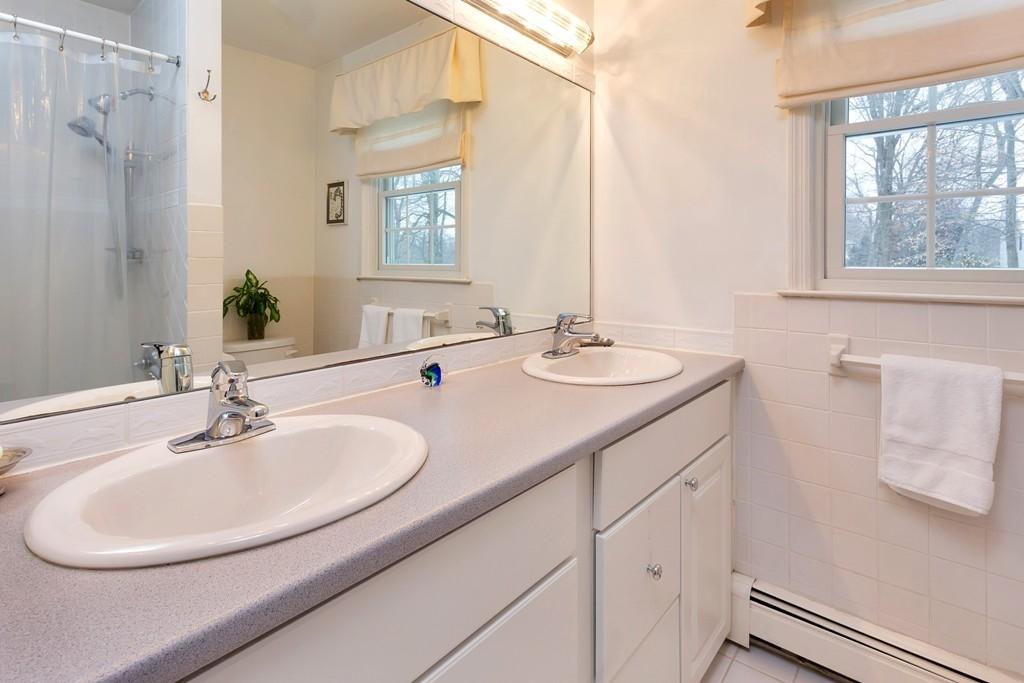 5 Country Club Road Darien, CT 06820 - Photo 16 of 20 a bathroom with a sink and a mirror