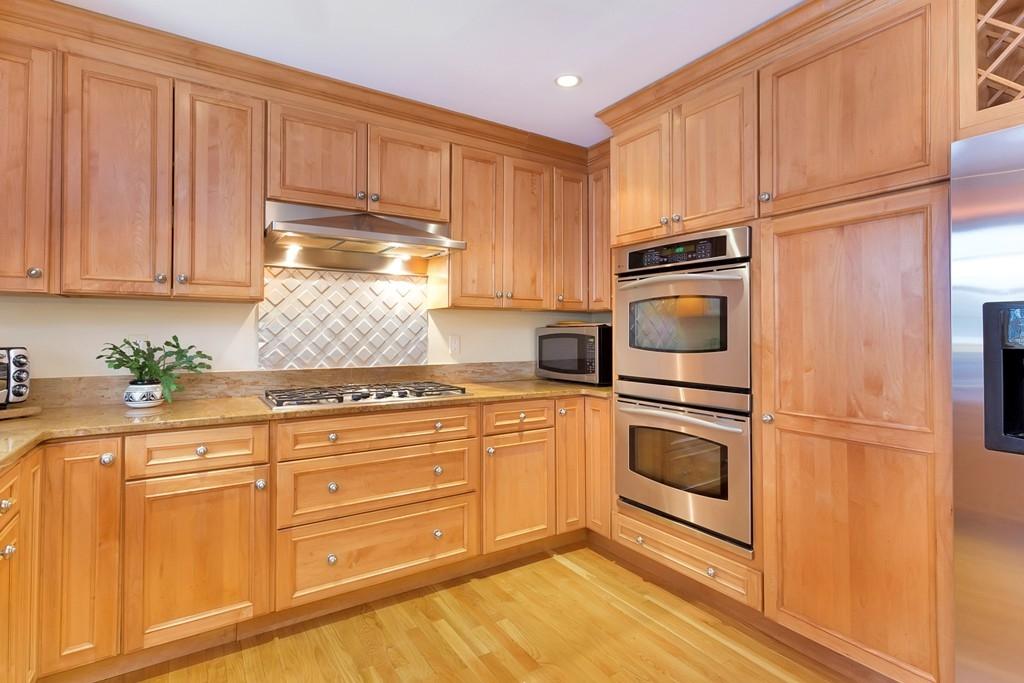 5 Country Club Road Darien, CT 06820 - Photo 9 of 20 a kitchen with granite countertop cabinets stainless steel appliances and sink