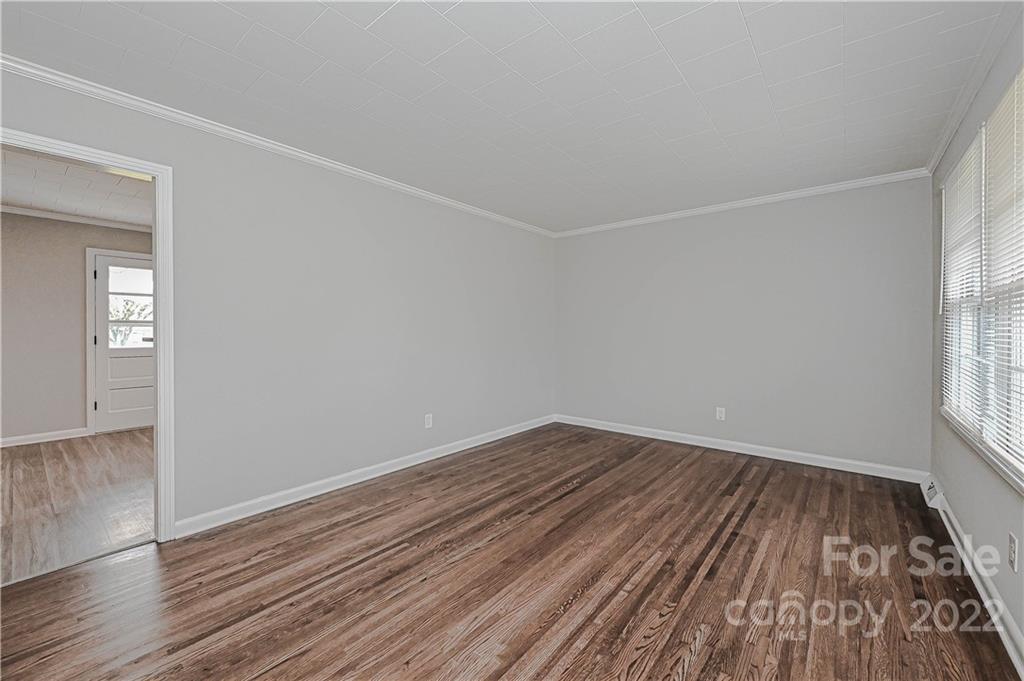 799 Sunderland Road Southwest Concord, NC 28027 - Photo 11 of 26 wooden floor in an empty room with a window