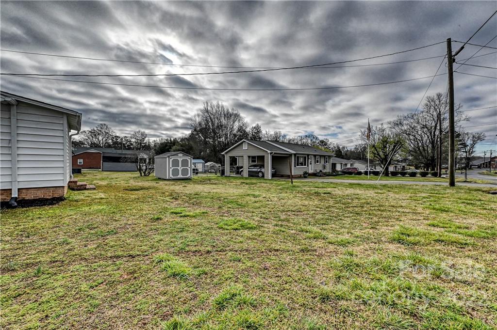 799 Sunderland Road Southwest Concord, NC 28027 - Photo 20 of 26 a view of a house with a yard