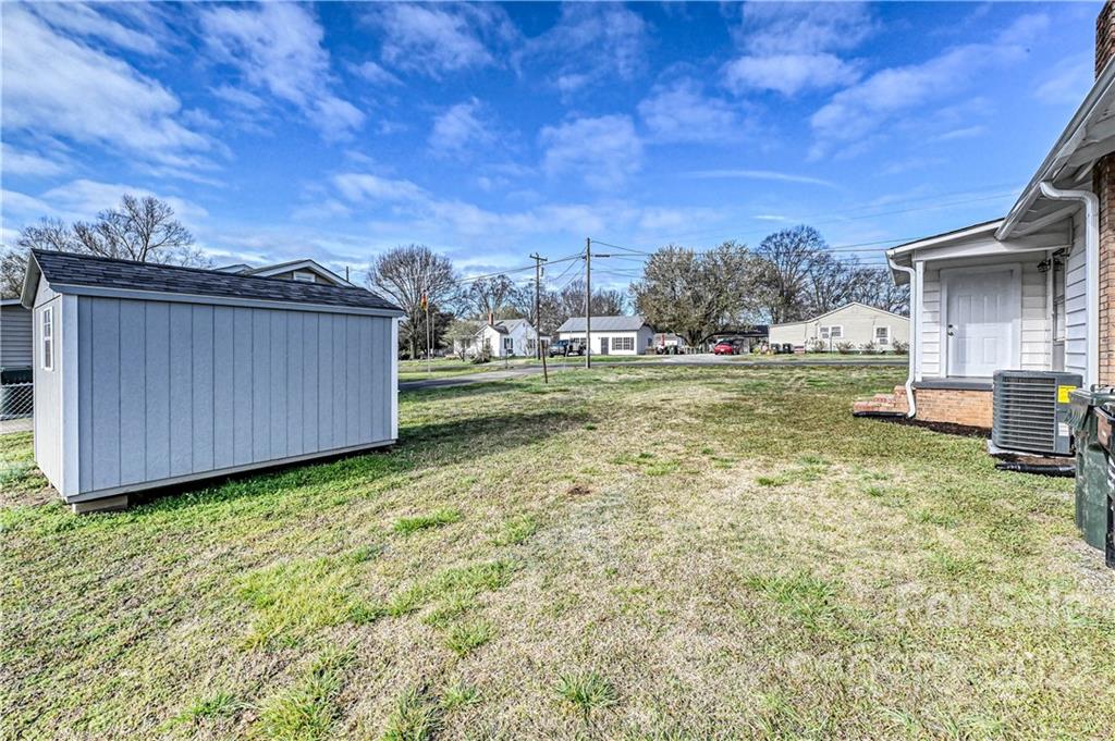799 Sunderland Road Southwest Concord, NC 28027 - Photo 22 of 26 a view of a backyard with wooden fence