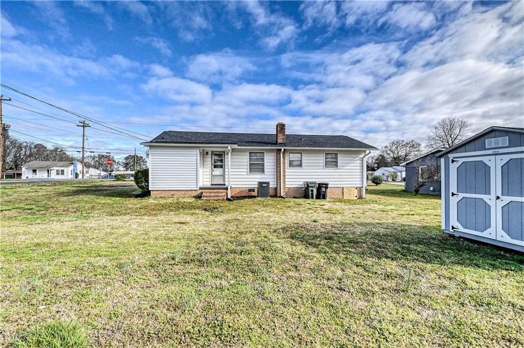 799 Sunderland Road Southwest Concord, NC 28027 - Photo 23 of 26 a view of a house with a big yard