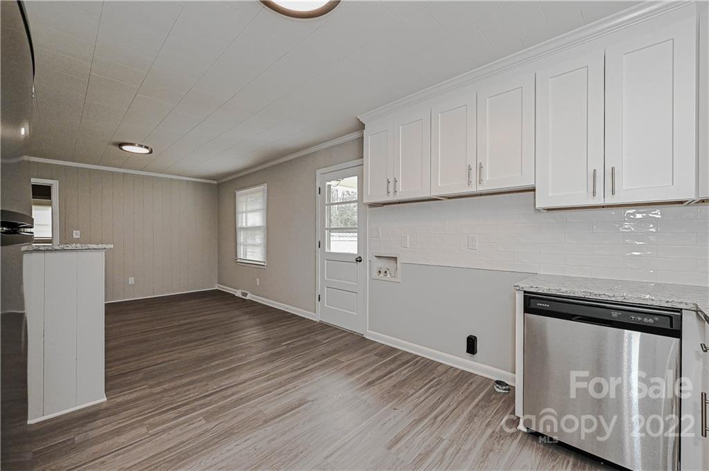 799 Sunderland Road Southwest Concord, NC 28027 - Photo 5 of 26 a view of kitchen with wooden floor