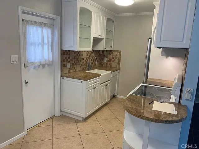 a kitchen that has a stove and a microwave
