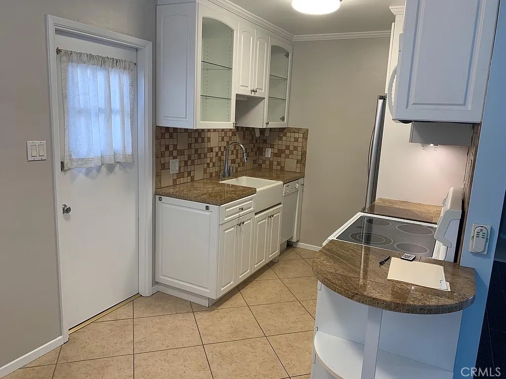 4401 East Division Street Long Beach, CA 90803 - Photo 15 of 49 2 Bed Kitchen with back door.