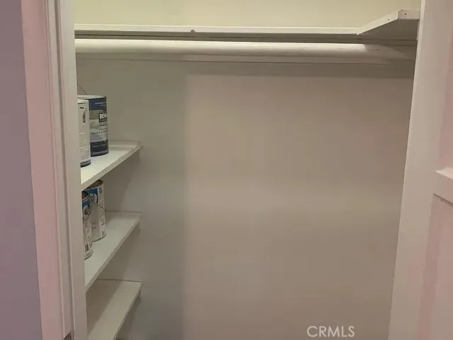 a bathroom with a sink and mirror with bathtub