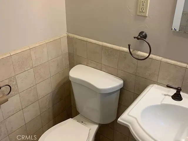 a kitchen with stainless steel appliances granite countertop a sink and a white cabinets