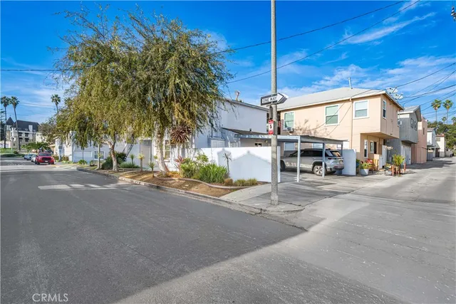 a view of a door of the house and car parked