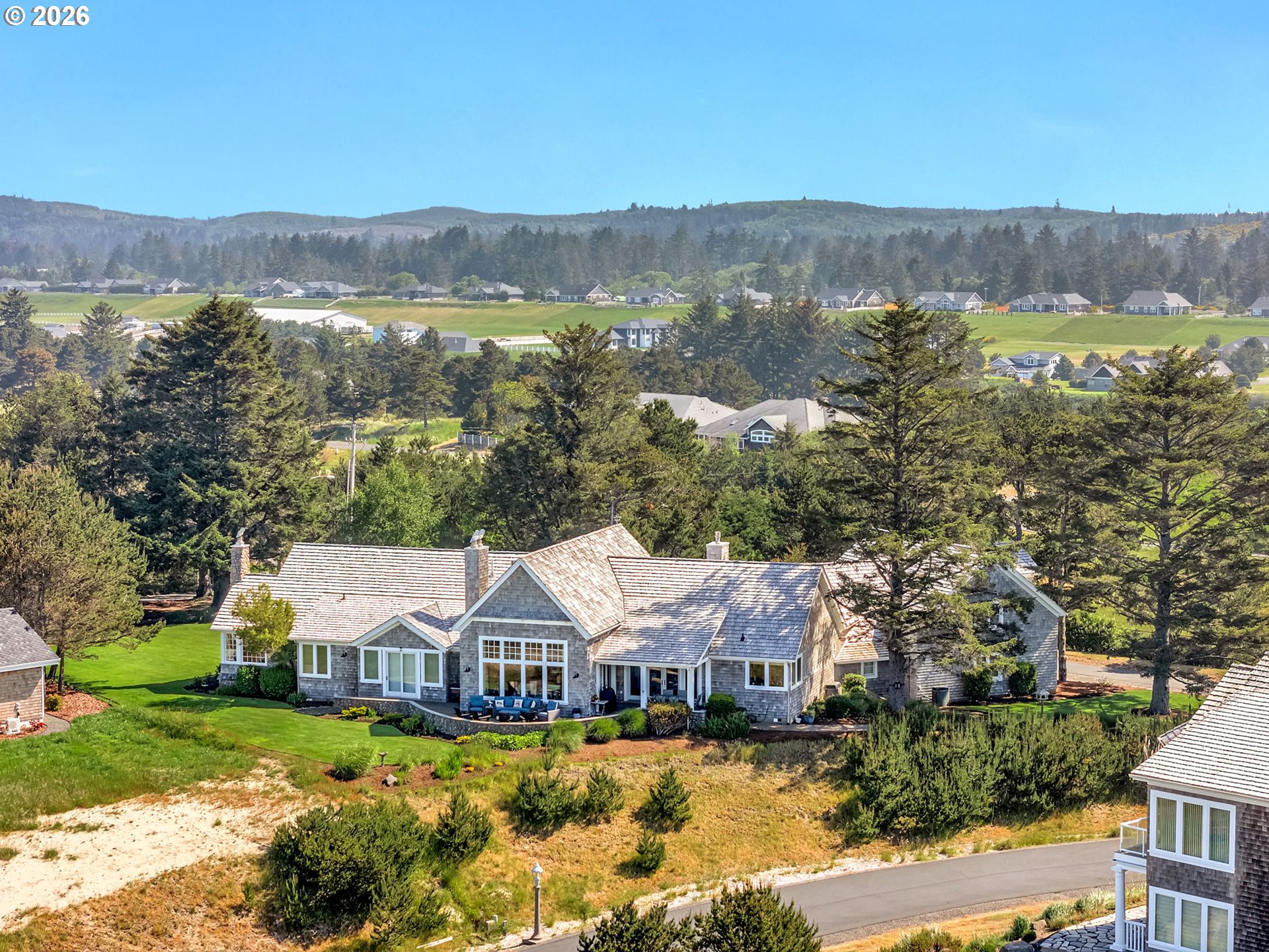 89079 Pinehurst Road Warrenton, OR 97146 - Photo 6 of 46 a view of house with outdoor space and a lake view