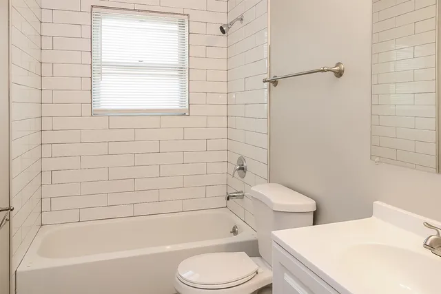 a bathroom with a toilet sink and bathtub