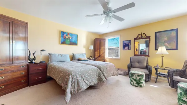 a spacious bedroom with a bed and furniture