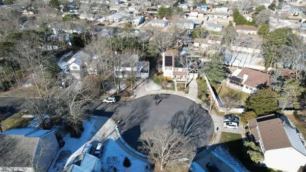 an aerial view of houses with outdoor space