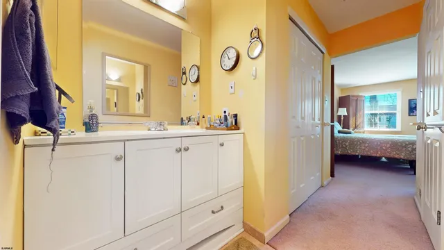 a outdoor space with lots of tables a chandelier and a rug