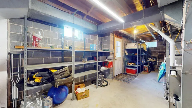 a view of a house with snow on the side of the road