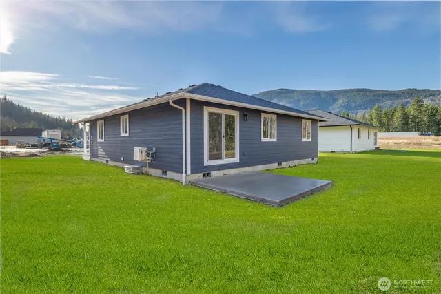 a front view of house with yard and green space