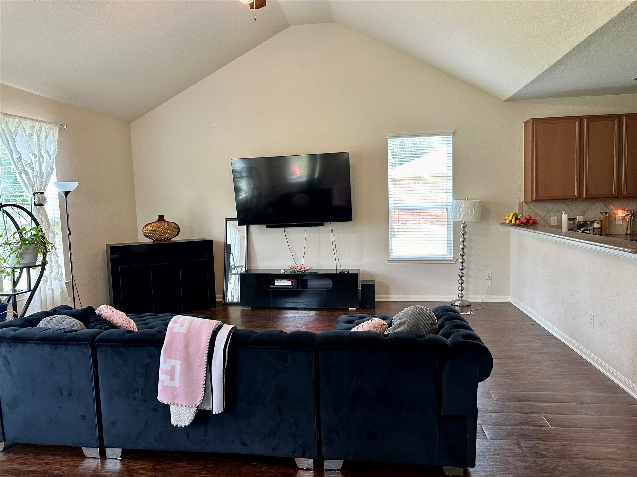 18622 Each Elm Way Houston, TX 77084 - Photo 3 of 35 a living room with furniture and a flat screen tv