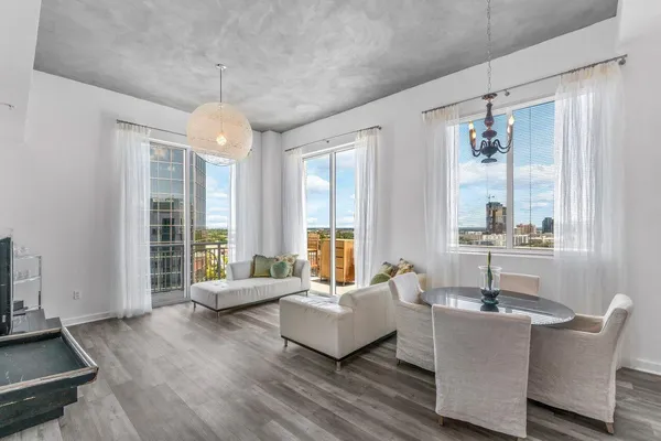 a living room with furniture and a large window