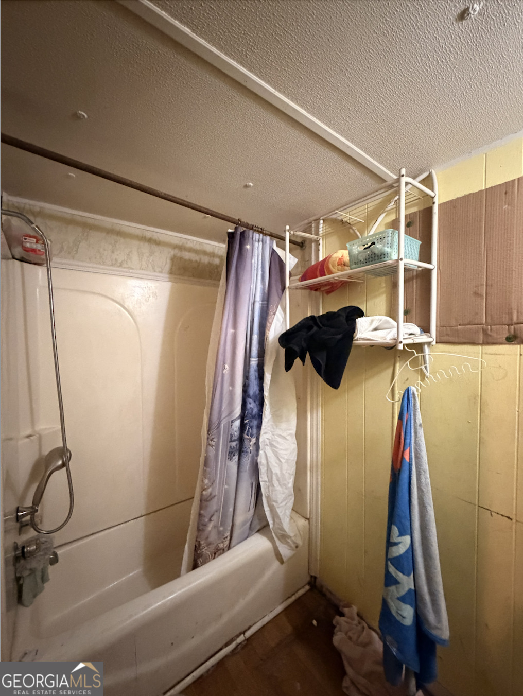 258 Persimmon Street Toccoa, GA 30577 - Photo 15 of 25 a view of walk in closet with clothes and shoes
