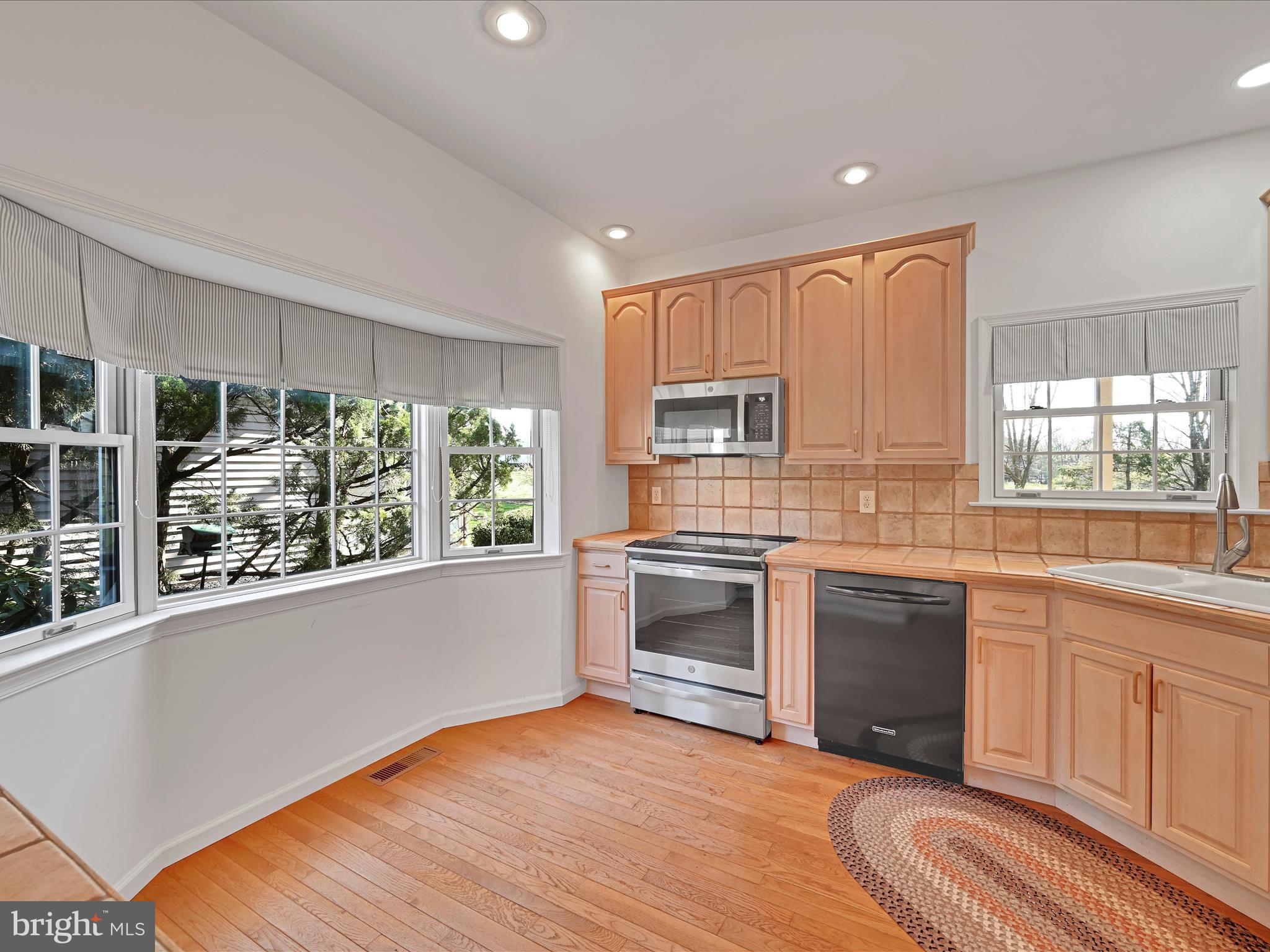 520 Waterside Circle Lebanon, PA 17042 - Photo 12 of 35 a kitchen with stainless steel appliances granite countertop a stove and a sink