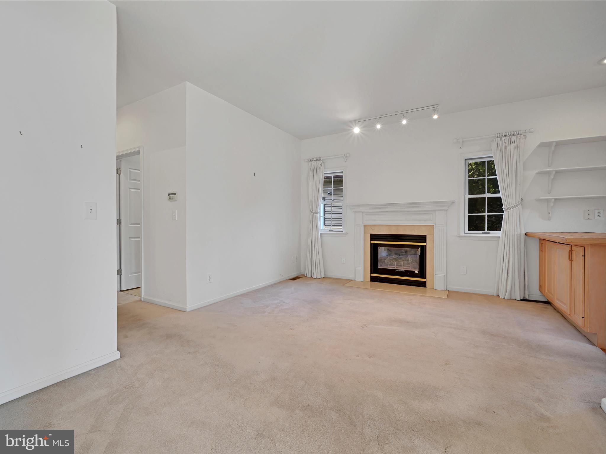 520 Waterside Circle Lebanon, PA 17042 - Photo 16 of 35 an empty room with fireplace and windows