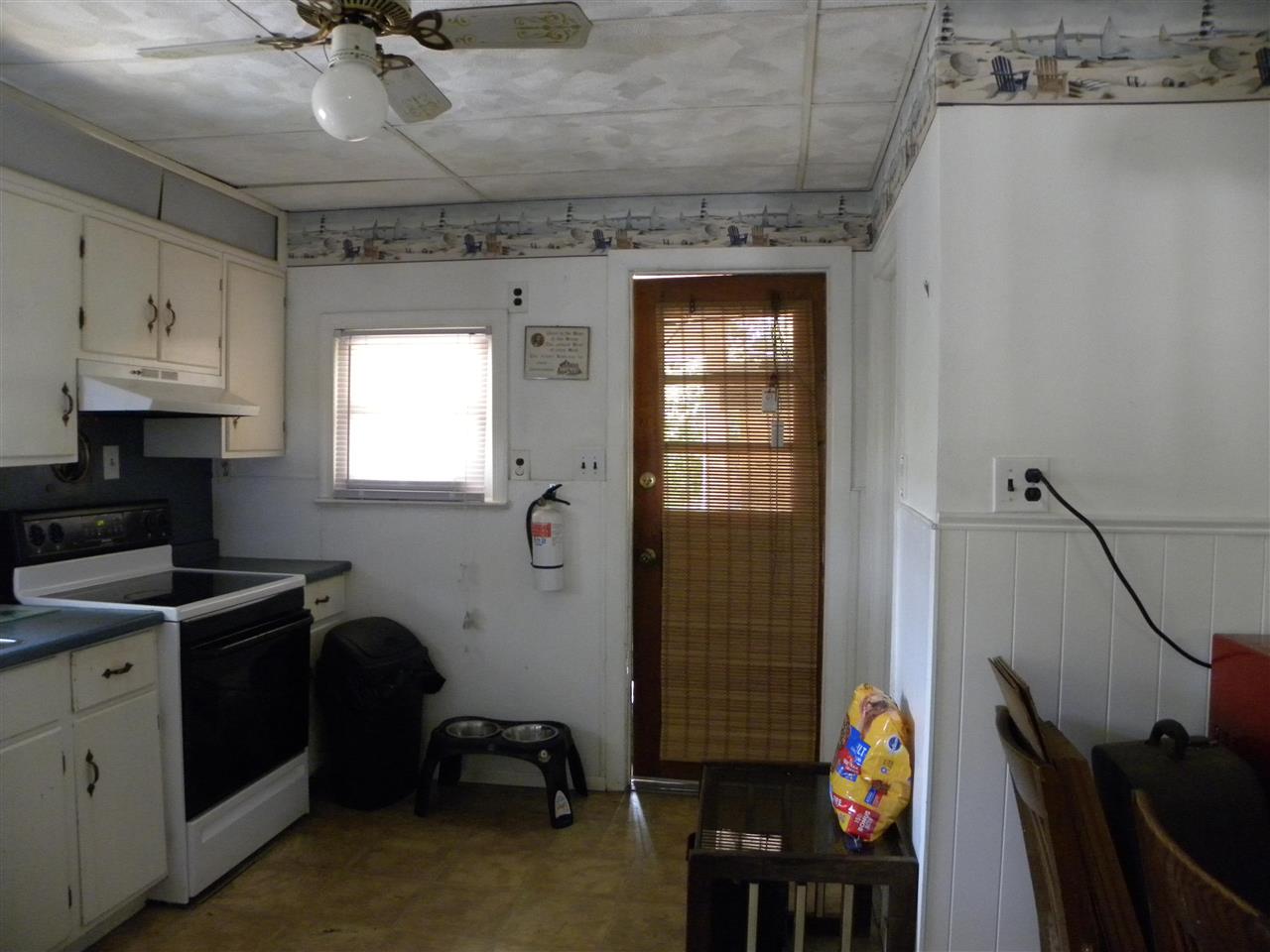 52 Warwick Road Villas, NJ 08251 - Photo 11 of 20 a view of a workspace with furniture and a window