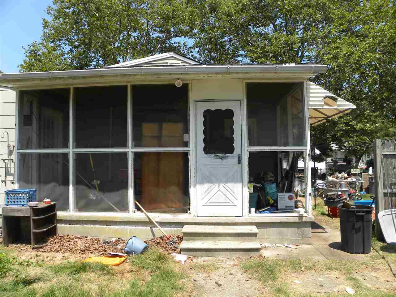 52 Warwick Road Villas, NJ 08251 - Photo 18 of 20 a view of a house with a large window and yard