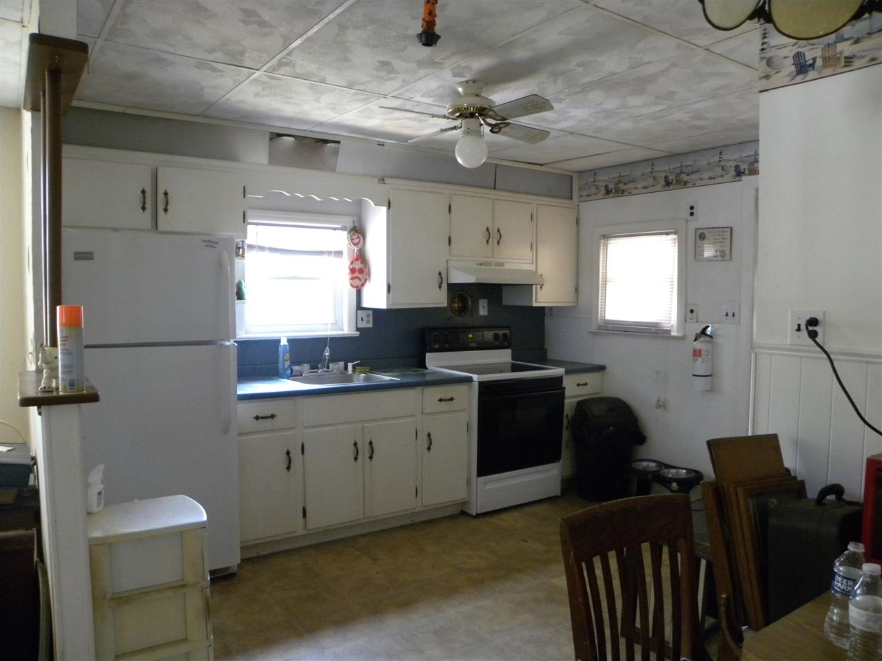 52 Warwick Road Villas, NJ 08251 - Photo 9 of 20 a kitchen with stainless steel appliances sink stove refrigerator and cabinets
