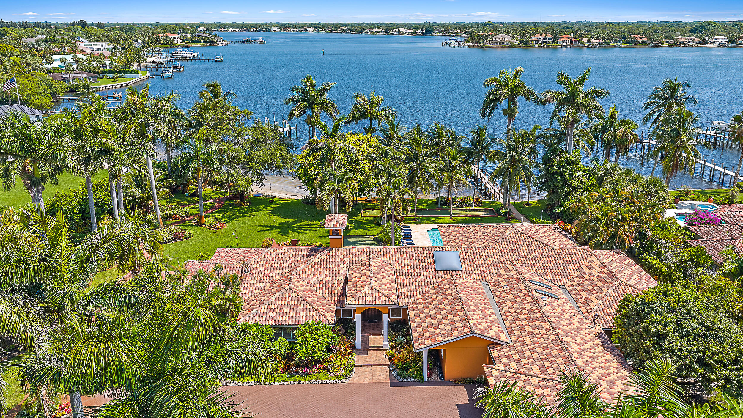 5900 Pennock Point Road Jupiter, FL 33458 - Photo 4 of 21 an aerial view of a house with a lake view