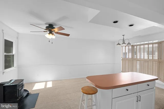 a kitchen with a sink cabinets and window