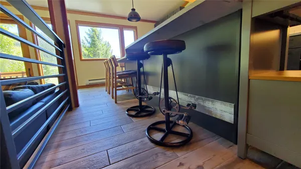 a view of entryway with wooden floor