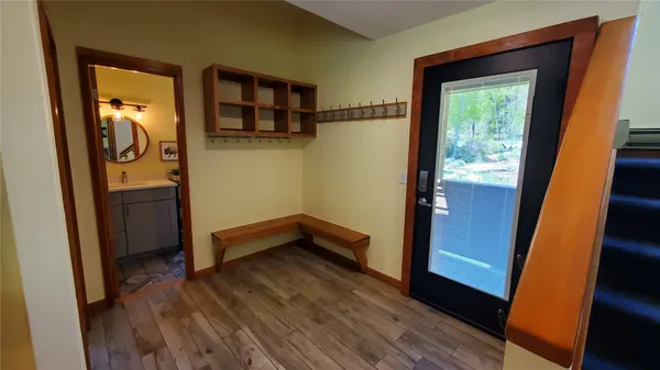 a room with wooden floor and a window