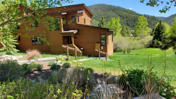a backyard of a house with lots of green space