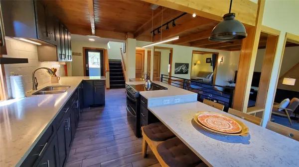 a dining room with furniture and wooden floor