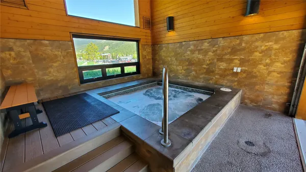 a view of a living room and a floor to ceiling window