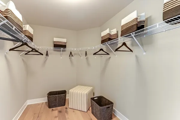 a view of storage and utility room with racks on the wall