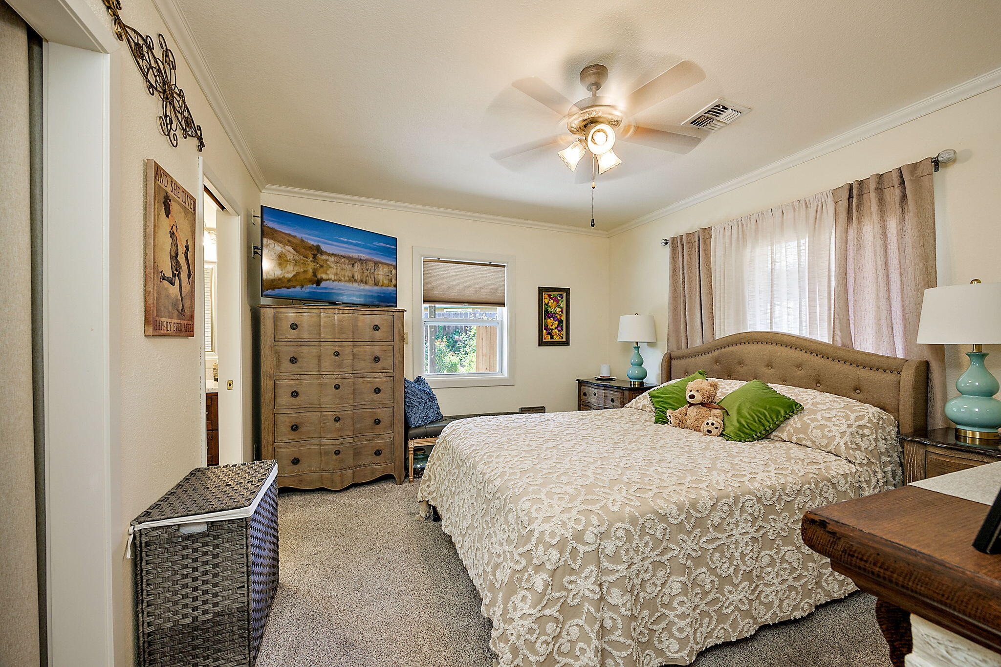 3744 Colver Road Phoenix, OR 97535 - Photo 39 of 58 a bedroom with a bed and ceiling fan