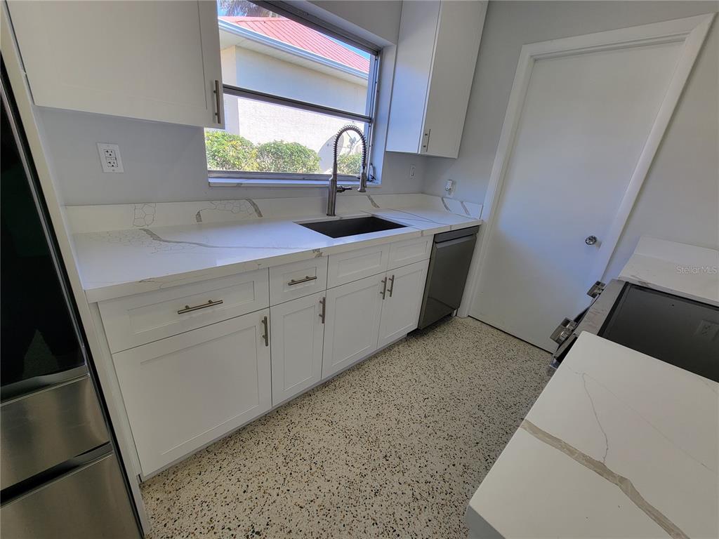 1732 Boca Raton Court Punta Gorda, FL 33950 - Photo 33 of 64 a sink with a vanity and mirror