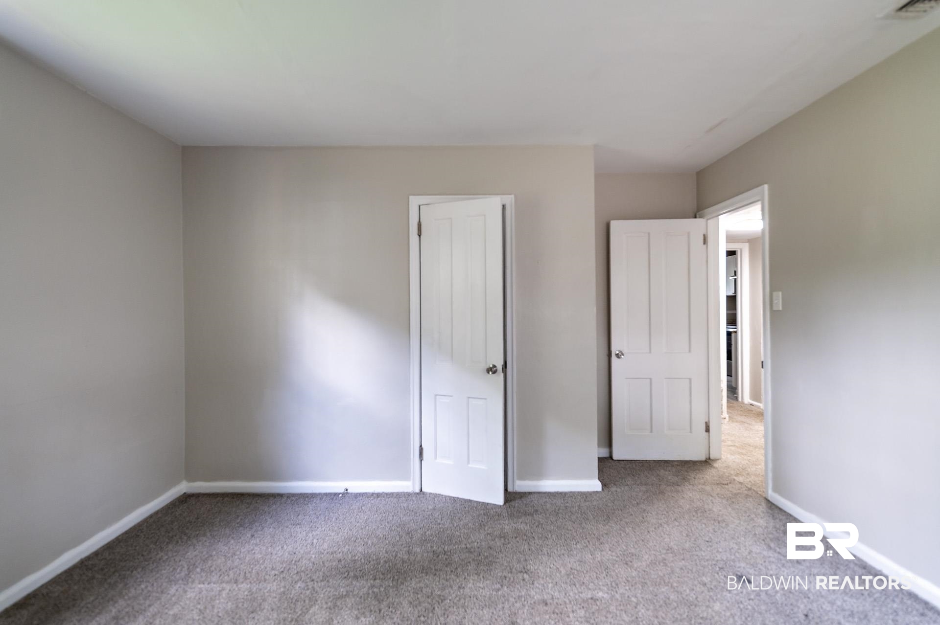 1869 Mott Drive West Mobile, AL 36617 - Photo 17 of 34 Unfurnished bedroom featuring baseboards, visible vents, and carpet