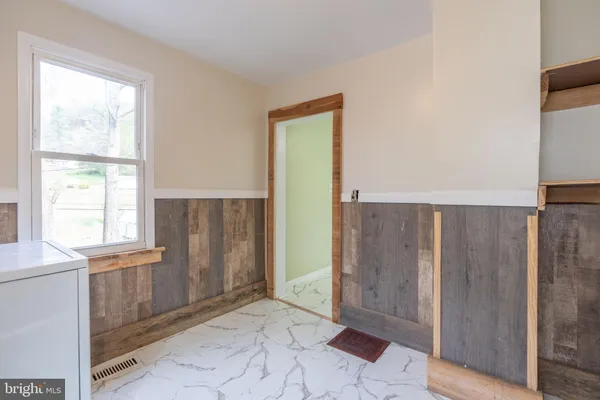 a view of a bathroom with a glass door shower