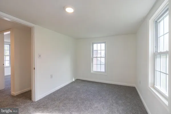 an empty room with windows