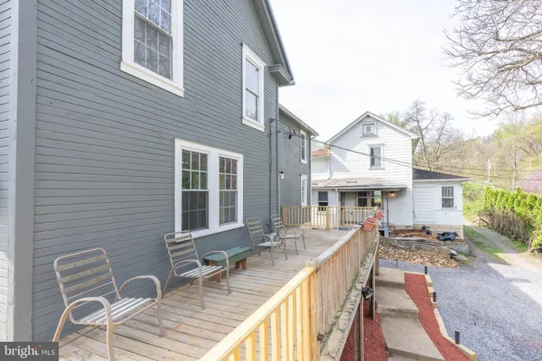 a view of a yard in front of a house with a small yard and plants