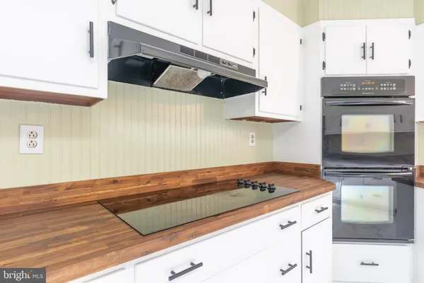 a kitchen with a stove and a microwave