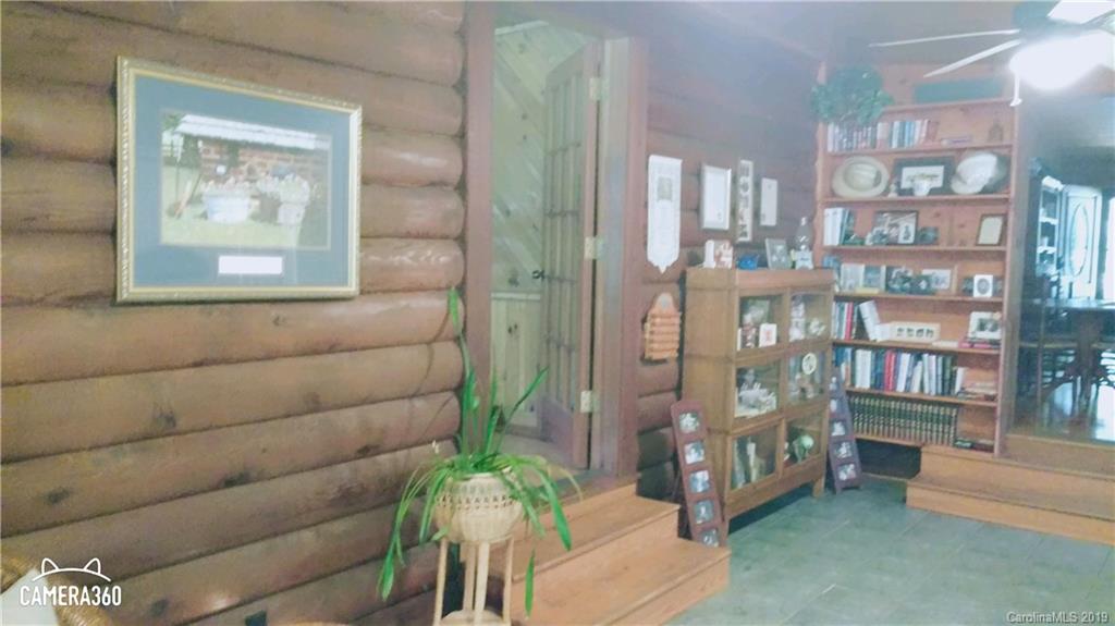 767 Holly Ridge Road Grover, NC 28073 - Photo 15 of 26 a living room with furniture and a potted plant