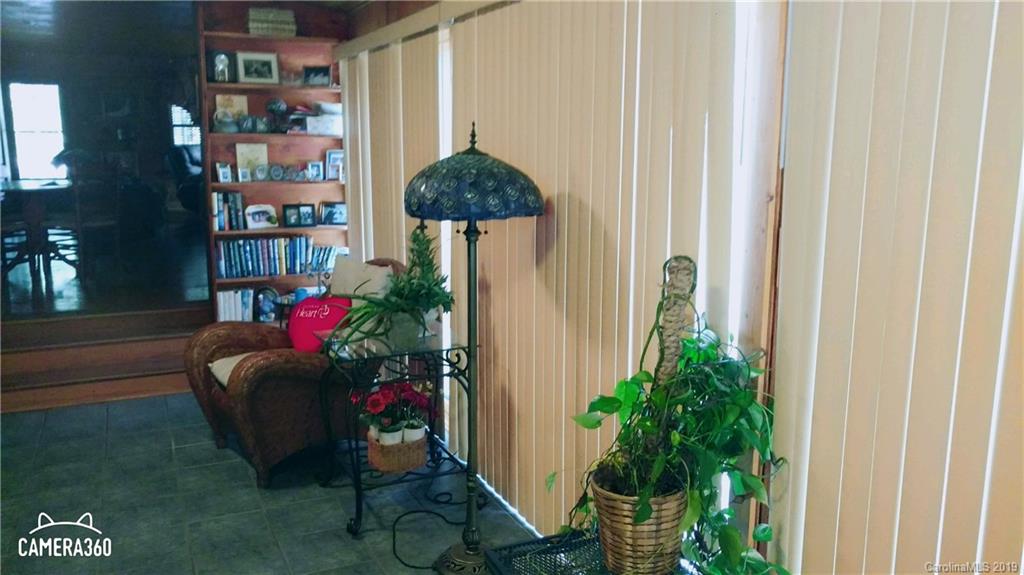 767 Holly Ridge Road Grover, NC 28073 - Photo 16 of 26 a living room with furniture and a potted plant